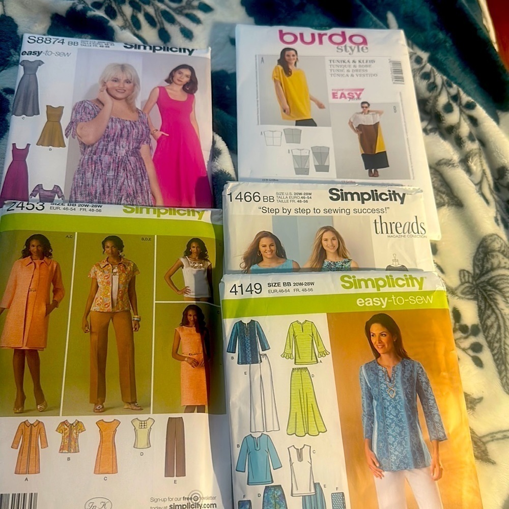 5 pattern sewing set. 5 New Simplicity sz 20w and 28w. 1 Burda sz 18-34